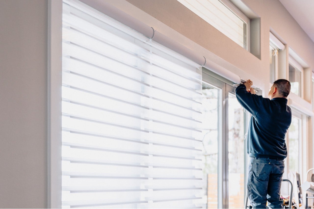 technician installing blinds at home Blind Guy of Tri-Cities