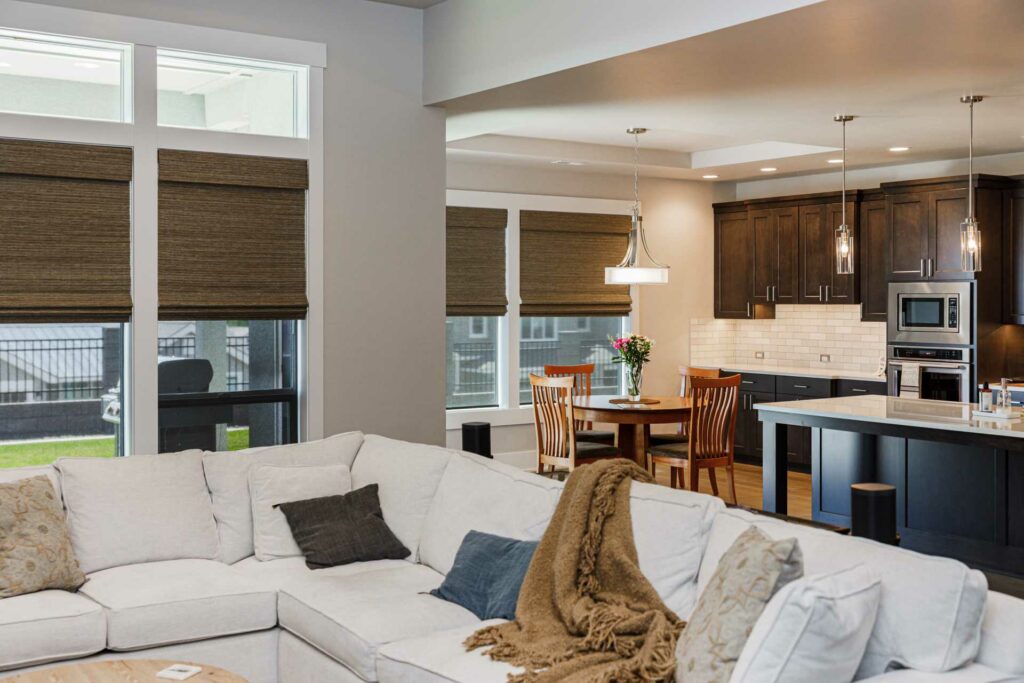 a lovely living room with installed blinds by Blind Guy of Tri-Cities